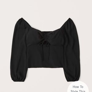 Long sleeved cinched front top NWOT
